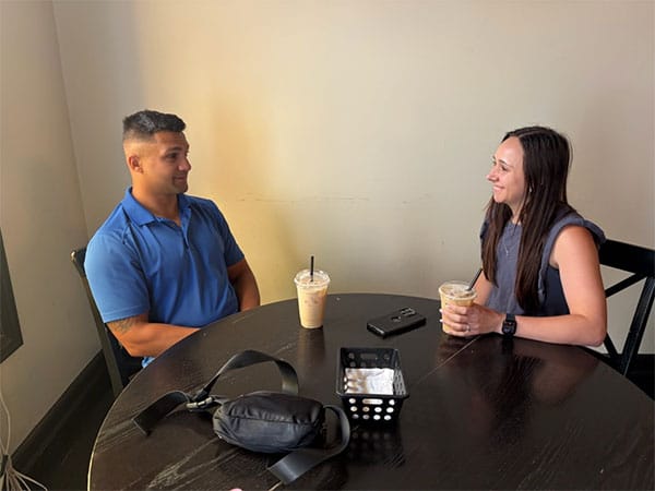 hopeful couple sharing coffee